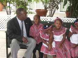 Dudley Grant and children on a bench